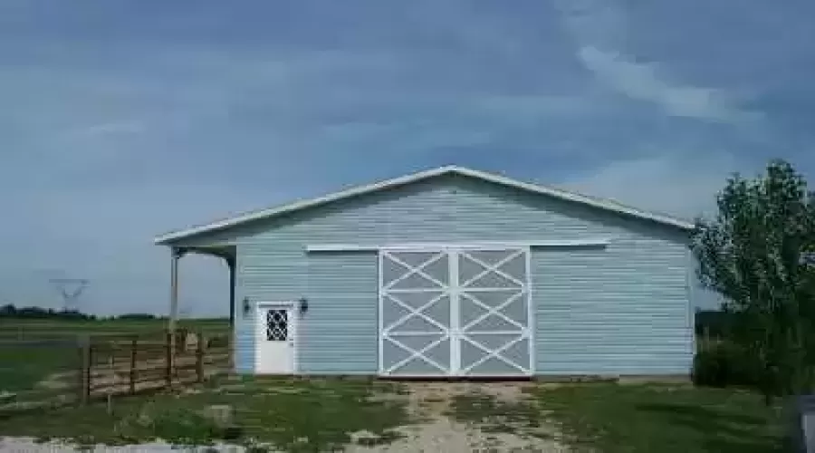 38'x58' Horse Barn with 3 Stalls, wash area and office. Barn has 14ft side walls and a 12ft door.