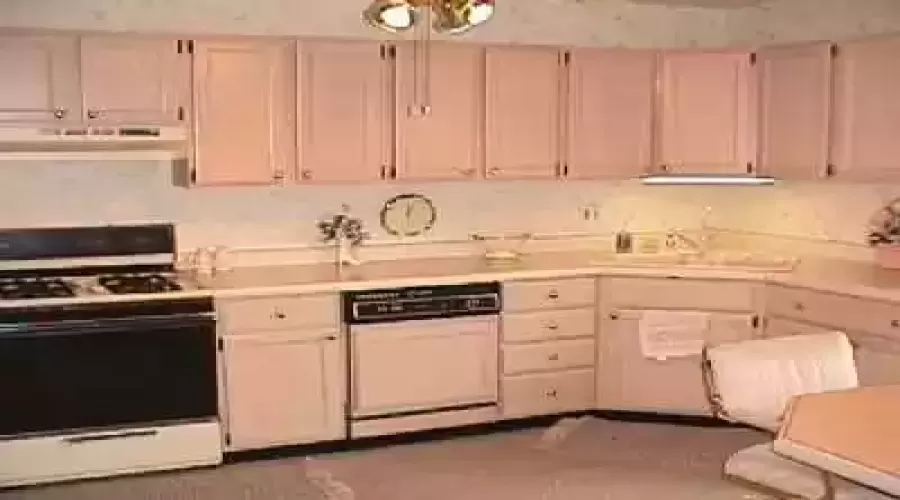 Kitchen features light pickled oak cabinets