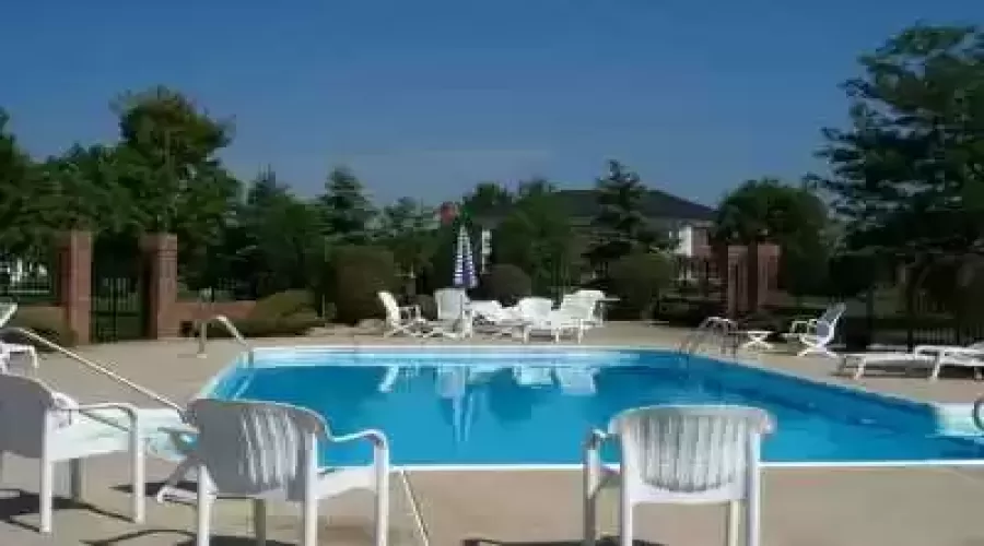 Relax and enjoy the season alongside the condominium association's pool.