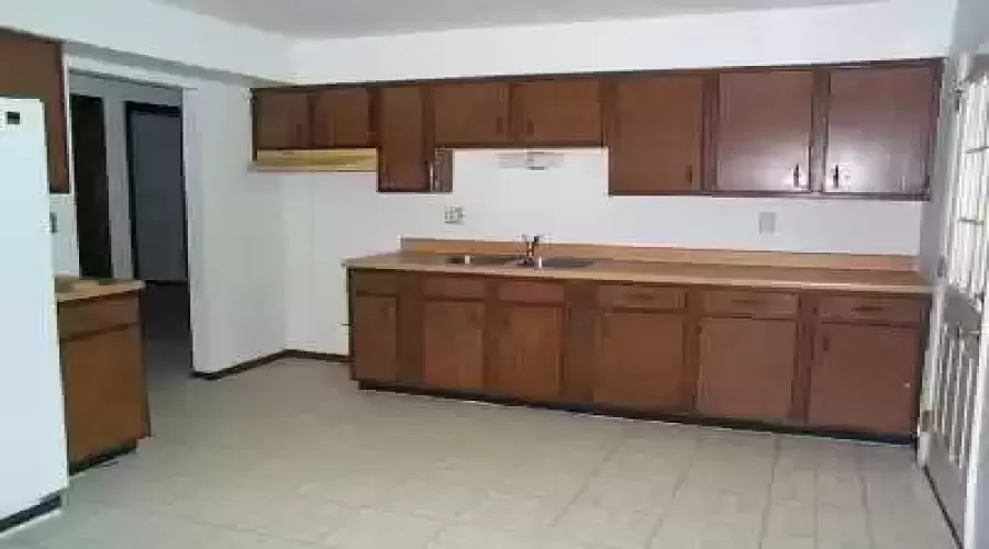 There are alot of cabinets  in the kitchen.