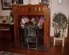 Fireplace in dining  room with hdwd floor  and beautiful wood-  work.