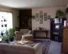 Living room features built in bookcase & gas fireplace.