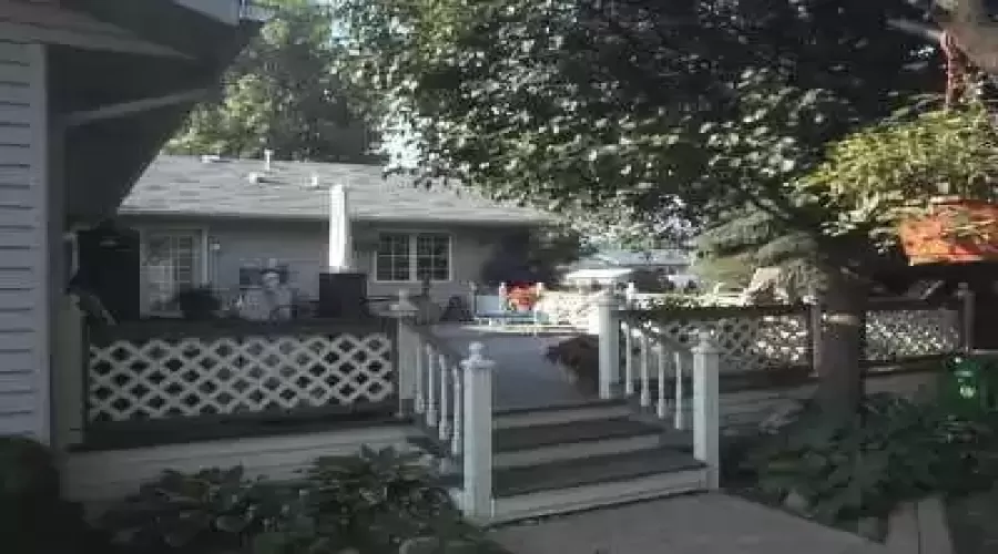 20x40 deck for lots of summer fun. Looks out onto exquisite landscaping