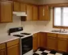 lot of cabinets oak and counter space easy of cooking.