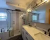 Amazing Master bath has glass doors in the shower and multiple shower heads