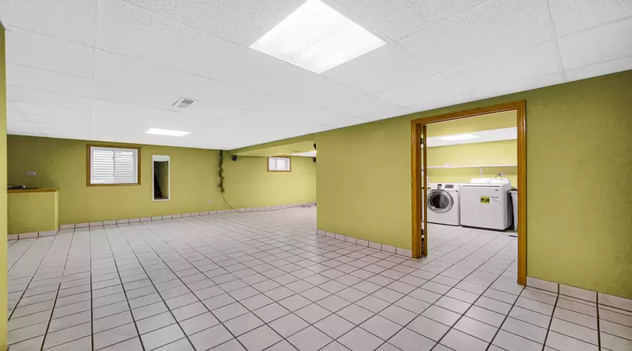 Spacious laundry room located in the basement.  Th