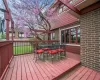 The backyard has mature trees.  Large deck with pe