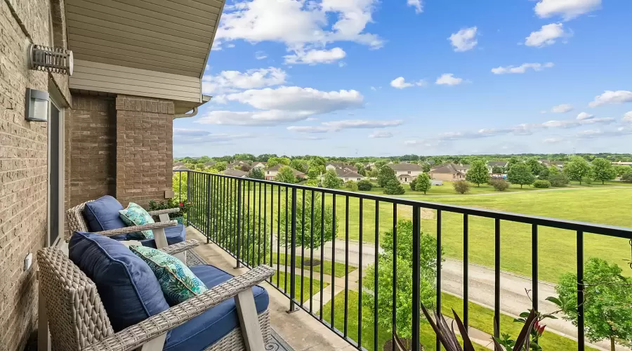 View of open green space from 4th floor balcony