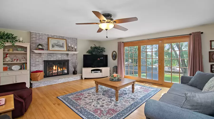 Sunlit Family Room features a Wood-Burning Firepla