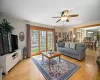 Sunlit Family Room features a Wood-Burning Firepla