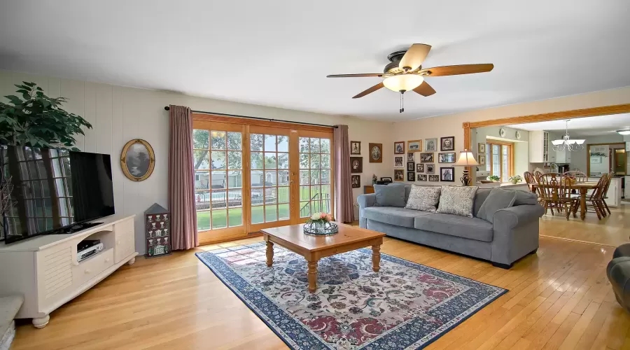 Sunlit Family Room features a Wood-Burning Firepla