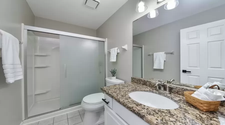 Shared hall bath includes large step-in