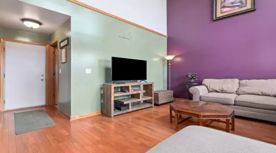 Family room hallway leads to both the powder room