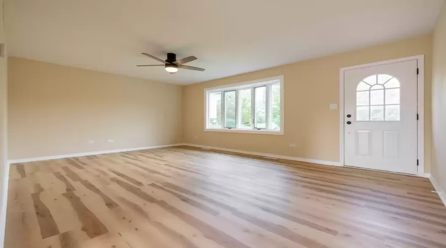 Tons of natural light flood this living room from